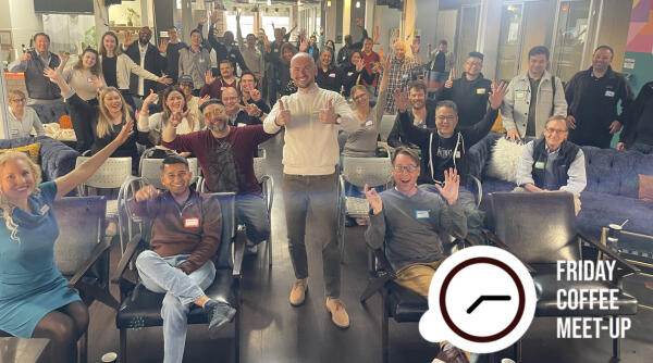 Friday Coffee Meetup photo from Friday Coffee Meetup event show presenter and audience smiling and waving at the camera with Friday Coffee logo in the corner